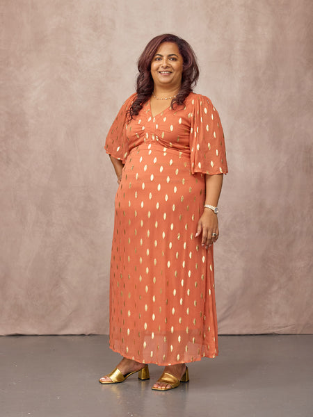Natasha wears size 14 Regular