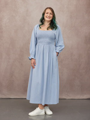 _0000s_0002_C23-Sam-Shirred-Dress-Blue-CUSTOMER-02.jpg