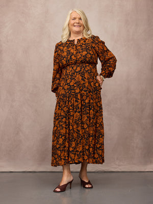 _0000s_0013_C25-Eleanor-Tiered-Skirt-Dress-Orange-Black-Floral-Print-CUSTOMER-02.jpg