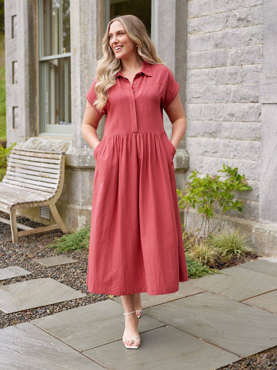 white dress and red heels Norma Kamali Sleeveless Swing Mini Dress