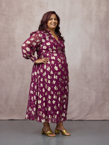 Natasha wears size 14 Regular