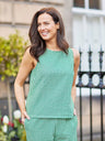 Ruby Tank Top in green gingham seersucker, worn as a co-ord set outdoors. Sleeveless, square neck, relaxed fit.
