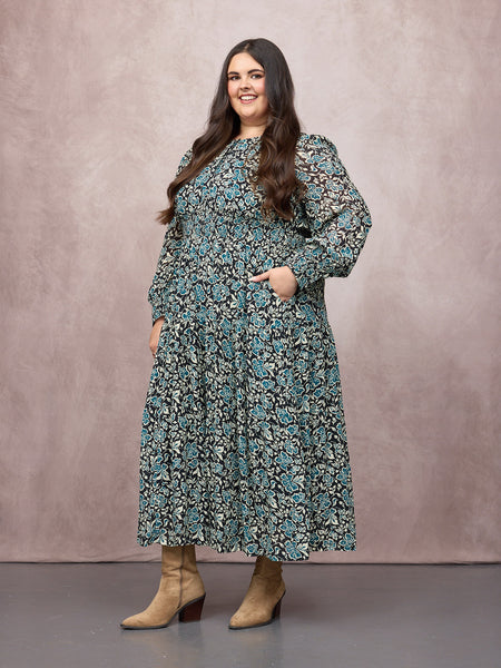 Lucy wears size 24 Regular