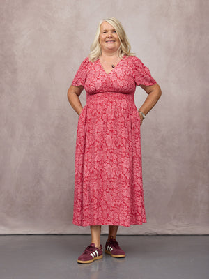 _0006s_0007_C25-Maddie-Short-Angel-Sleeve-Dress-Pink-&-Red-Abstract-Flower-Print-CUSTOMER-03.jpg