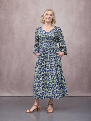_0007s_0009_C25-Maddie-Long-Sleeve-Dress-Navy-&-Green-Leaf-Print-CUSTOMER-02.jpg