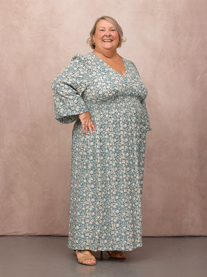 _0008s_0002_C27-Maddie-Long-Sleeve-V-Neck-Dress-Teal-Leaf-Print-CUSTOMER-04.jpg