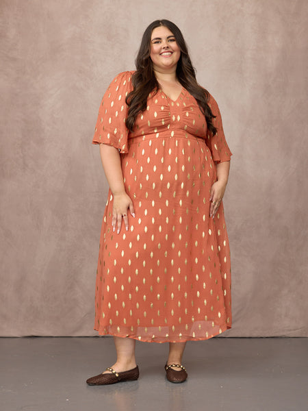 Lucy wears size 24 Regular