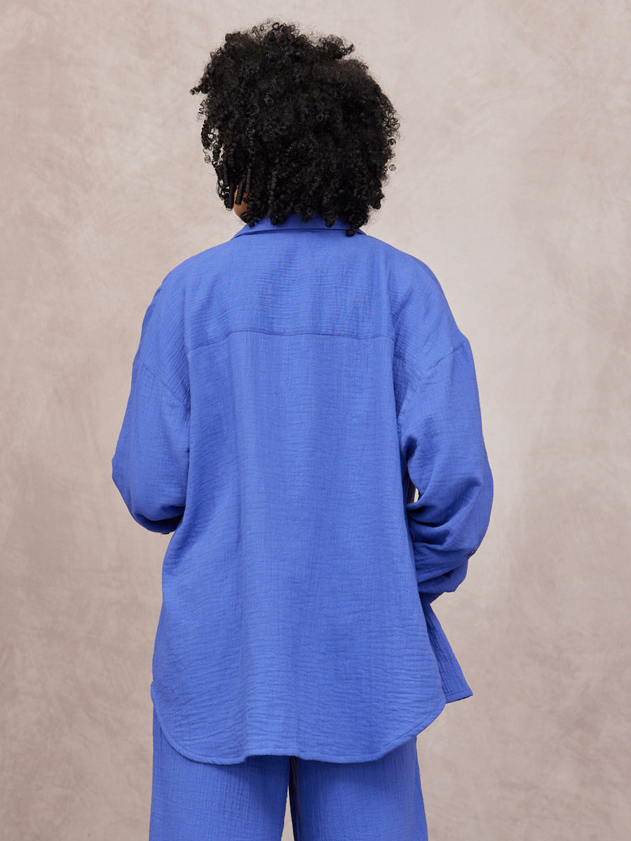 Deborah Oversized Cotton Crinkle Shirt in cobalt blue, back view, worn with matching wide-leg trousers