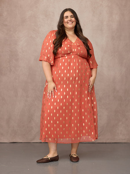 Lucy wears size 24 Regular