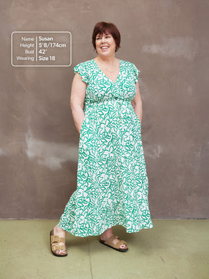 Studio shot, model wearing a size 18 Susan wrap maxi dress with a size guide