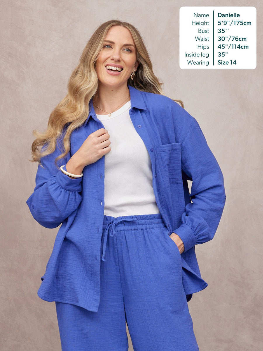 Deborah Oversized Cotton Crinkle Shirt in cobalt blue, worn open over white tee with matching trousers, size 14 model