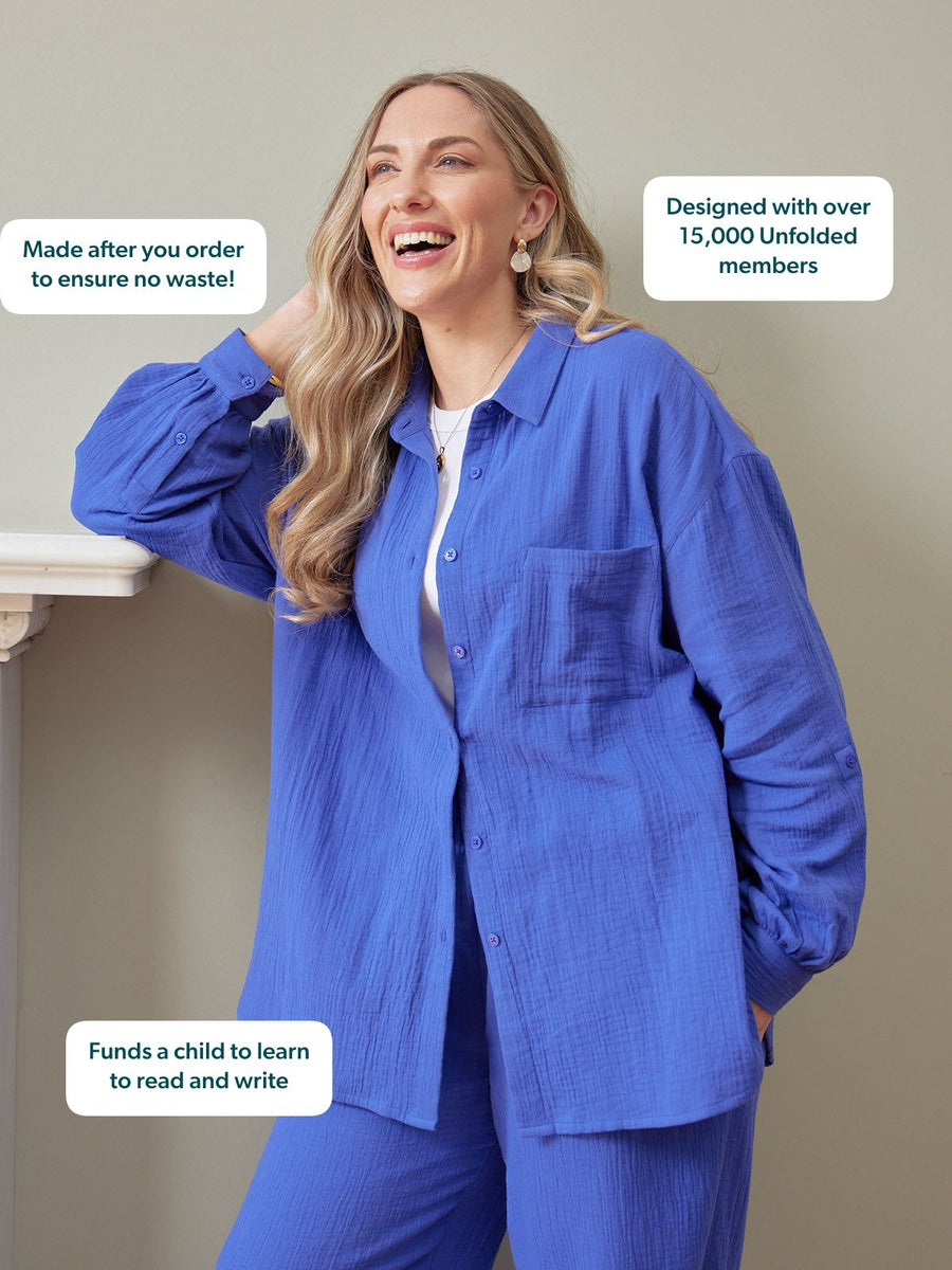 Deborah Oversized Cotton Crinkle Shirt in cobalt blue, worn open over white tee with matching trousers by smiling woman
