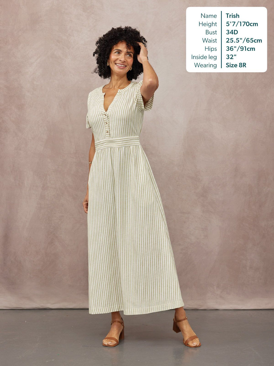Diana Stripe Dress in green and white, V-neck button detail, short sleeves, full-length A-line skirt, worn with tan