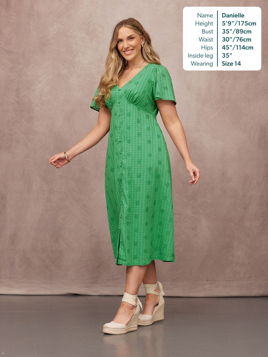 Allegra Broderie Dress in green, V-neck midi with flutter sleeves, button front & eyelet detail, worn with espadrille wedges
