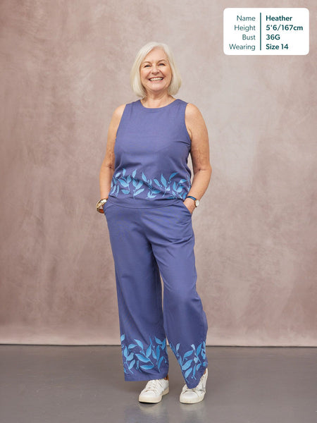 Co-Ord Embroidered Top & Trouser Bundle in blue, featuring floral leaf print hem detail, worn by a smiling model