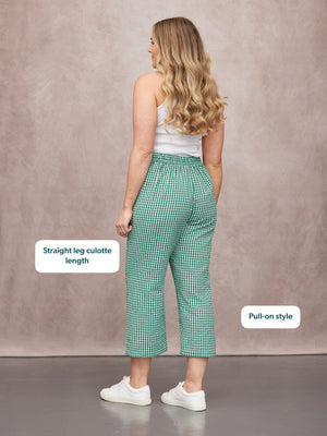 Rhianna Culotte in green gingham, straight-leg pull-on style, worn from behind with a white vest and white trainers.