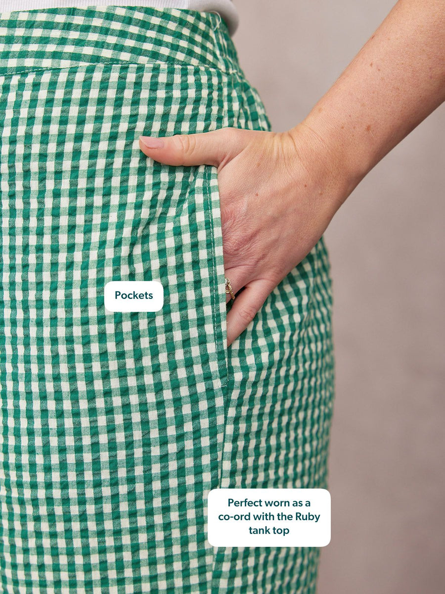 Rhianna Culotte in green gingham seersucker, close-up of side pocket with hand tucked in, paired with white tank top.