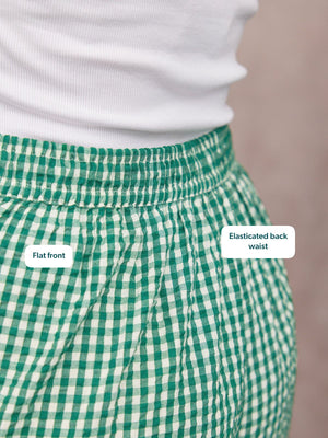 Rhianna Culotte in green gingham, close-up of flat front and elasticated back waist, paired with a white top.