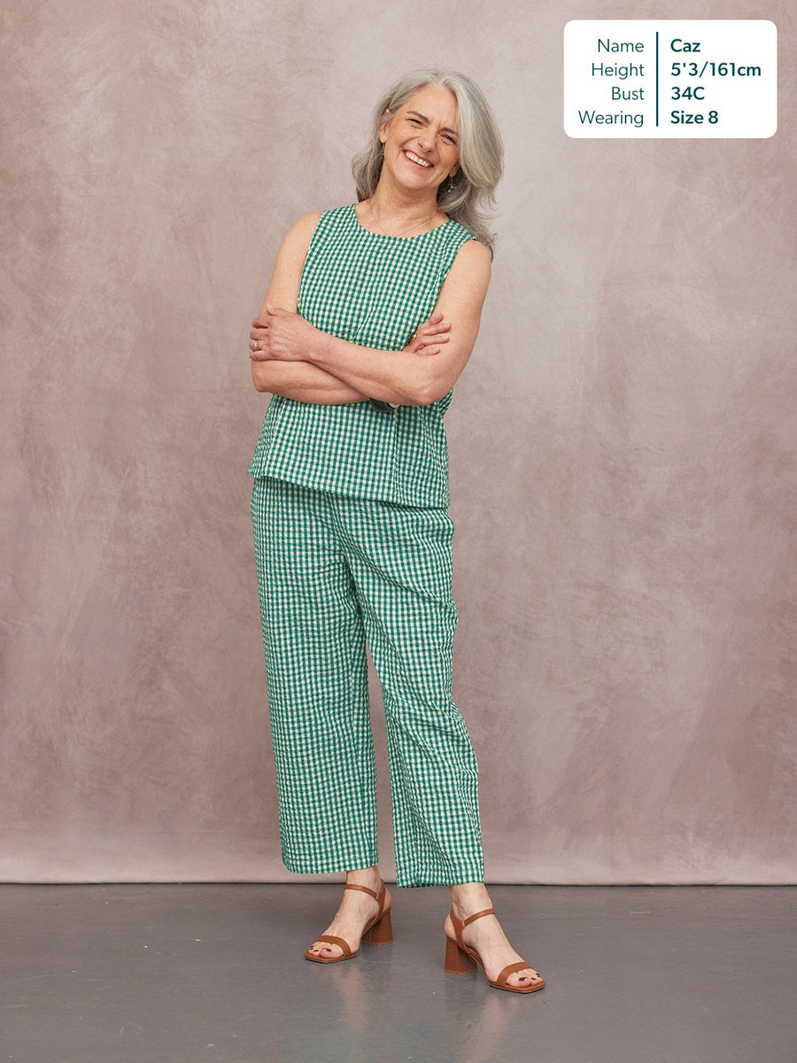 Ruby Tank Top in green gingham, sleeveless with round neck, worn with matching trousers and tan block-heel sandals.
