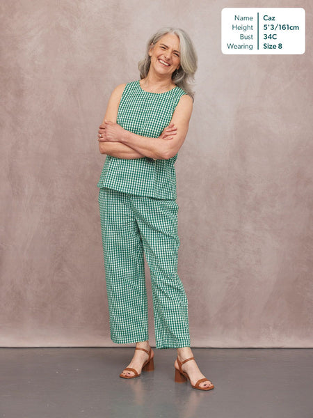 Ruby Tank Top in green gingham, sleeveless with round neck, worn with matching trousers and tan block-heel sandals.