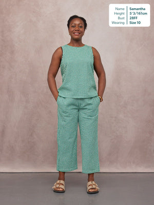 Ruby Tank Top in green gingham worn with matching wide-leg cropped trousers by a smiling woman, styled with tan sandals.