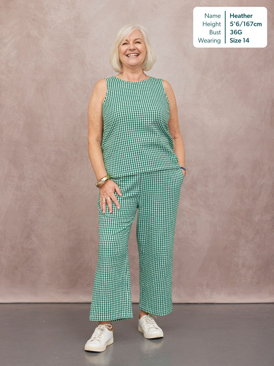 Ruby Tank Top in green gingham, worn by Heather, size 14, paired with matching wide-leg trousers and white trainers.