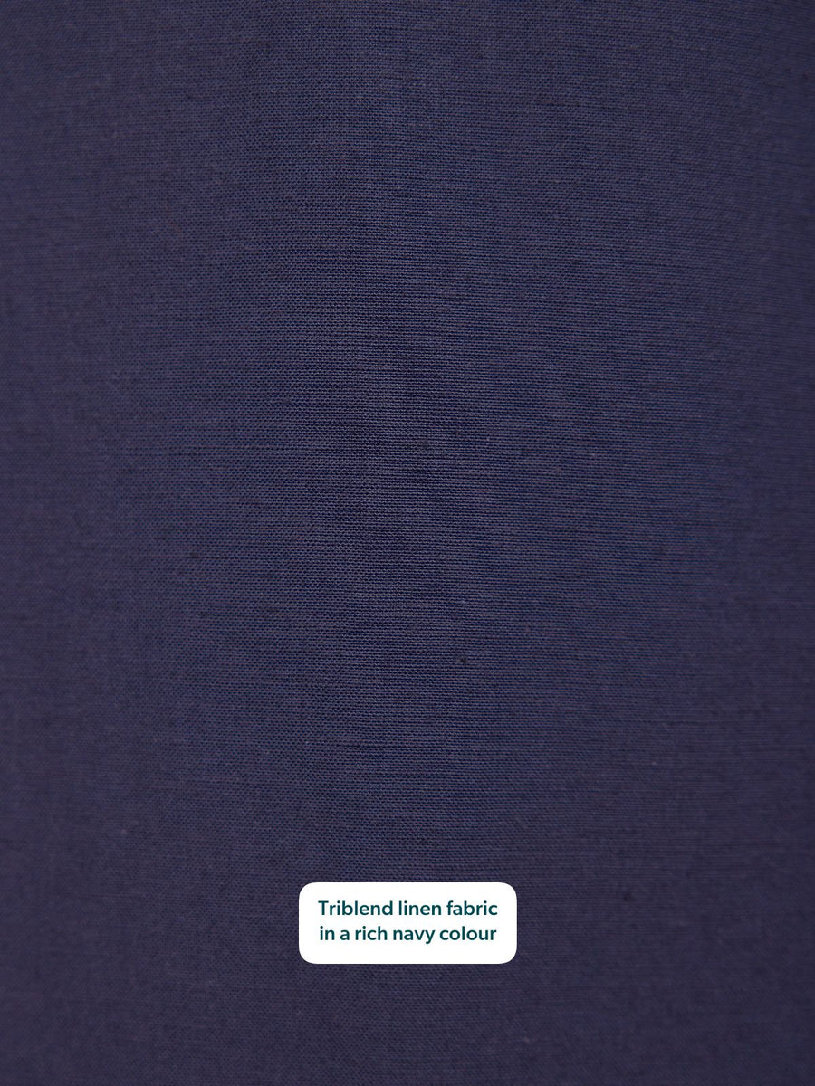 Close-up of rich navy triblend linen fabric showing a smooth, subtly textured weave.