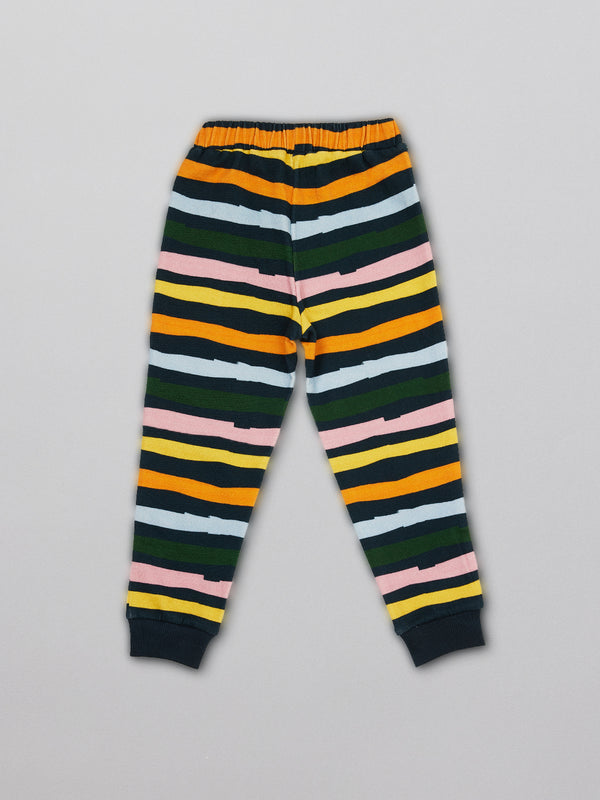 Eco-friendly kids tracksuit bottoms in wavy multicolour stripe, pictured from the front. 