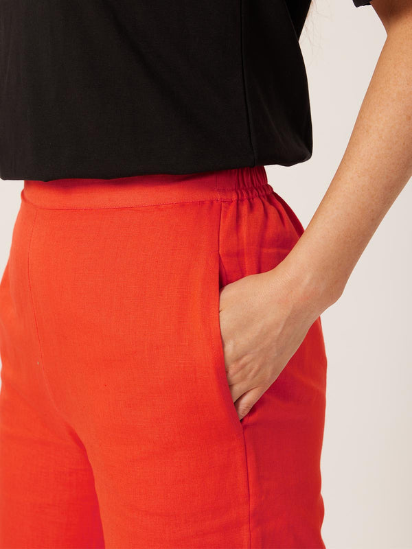 A close up of a model wearing the sustainable Gigi trousers from This is Unfolded, with a focus on the pockets. 