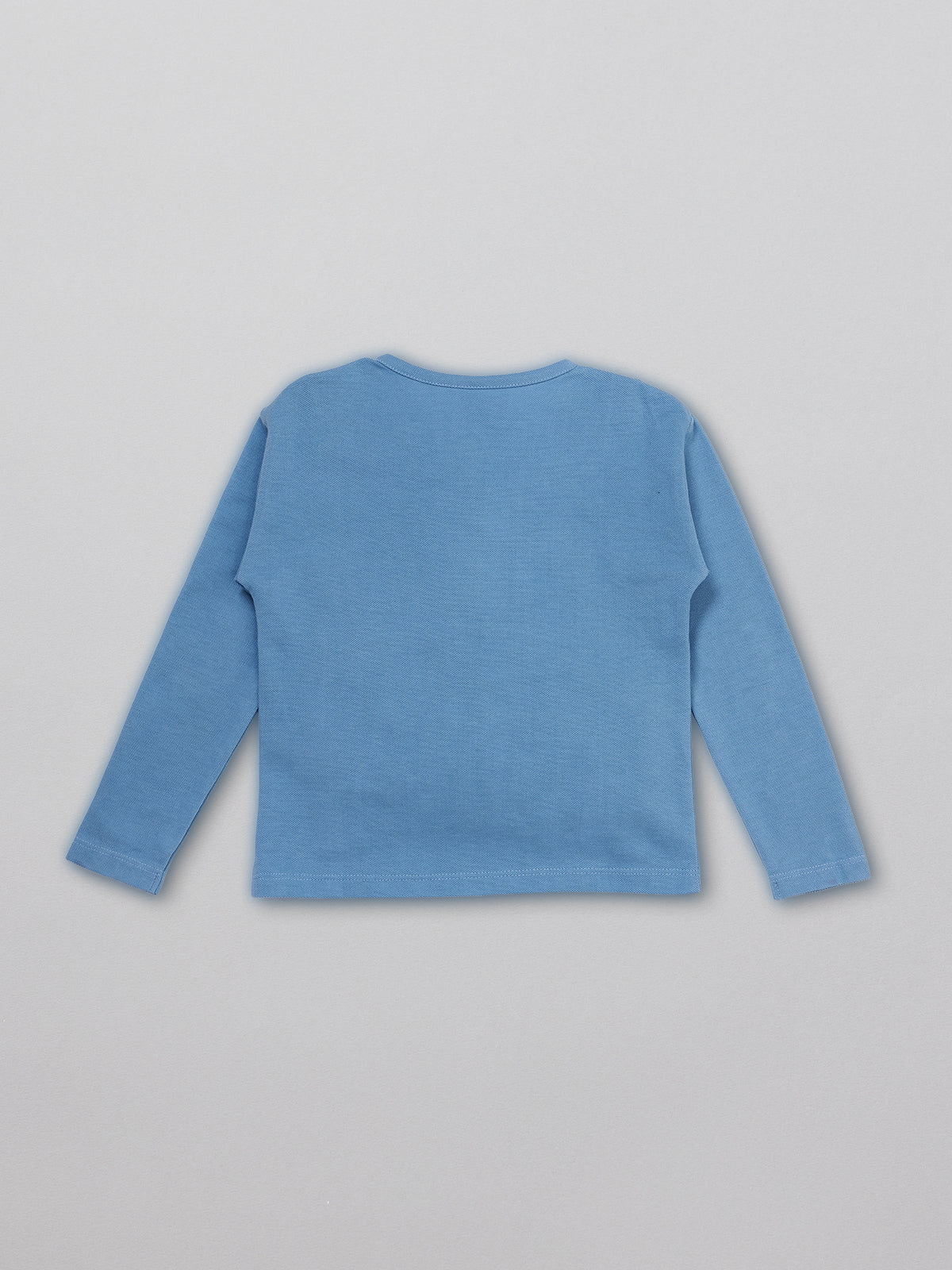 Sustainable kids pique t-shirt in blue with buttons, pictured from the back. 