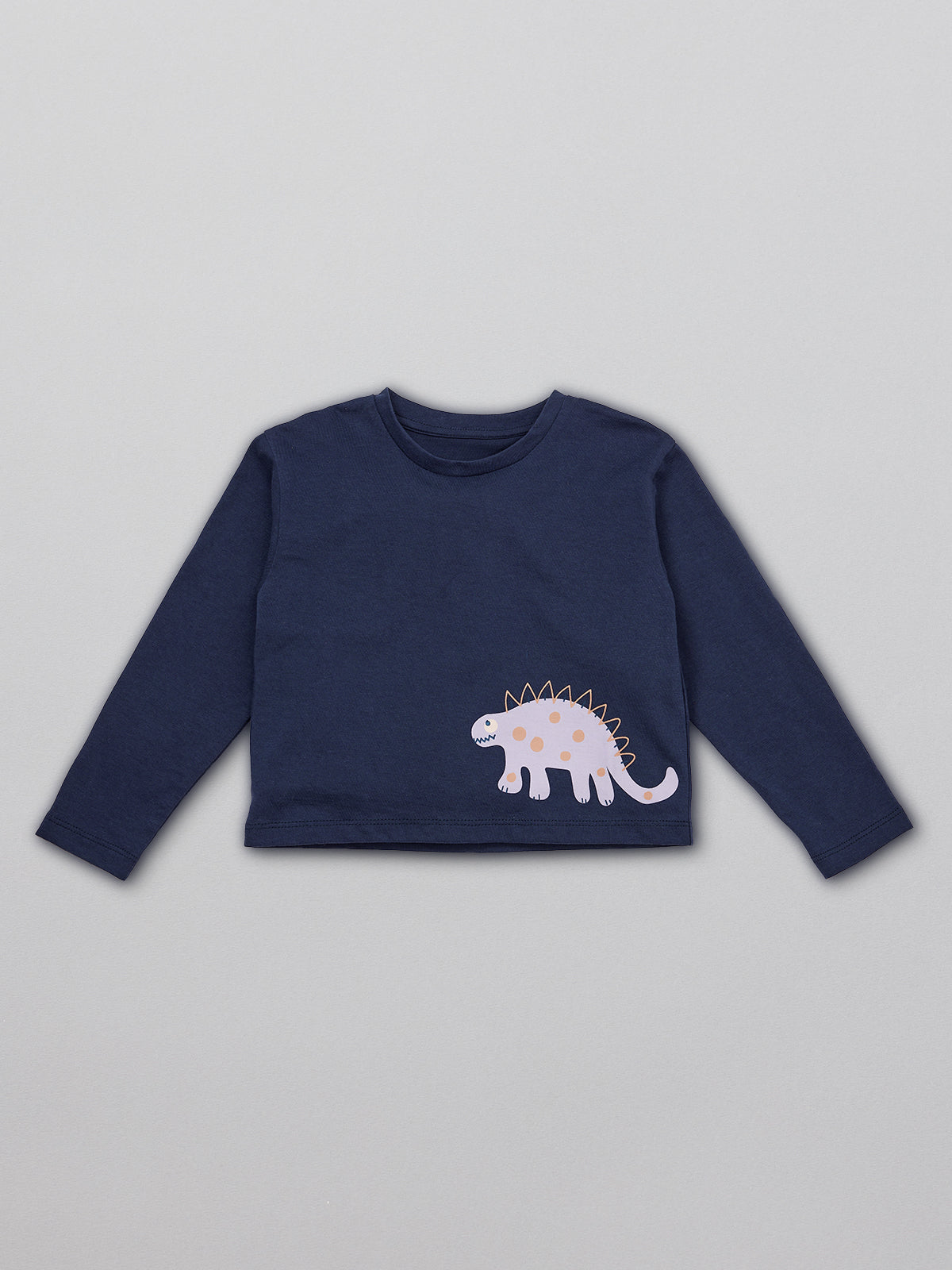 A sustainable long sleeved kids t-shirt in navy blue with a dinosaur print on the bottom right hand side, pictured from the front.  