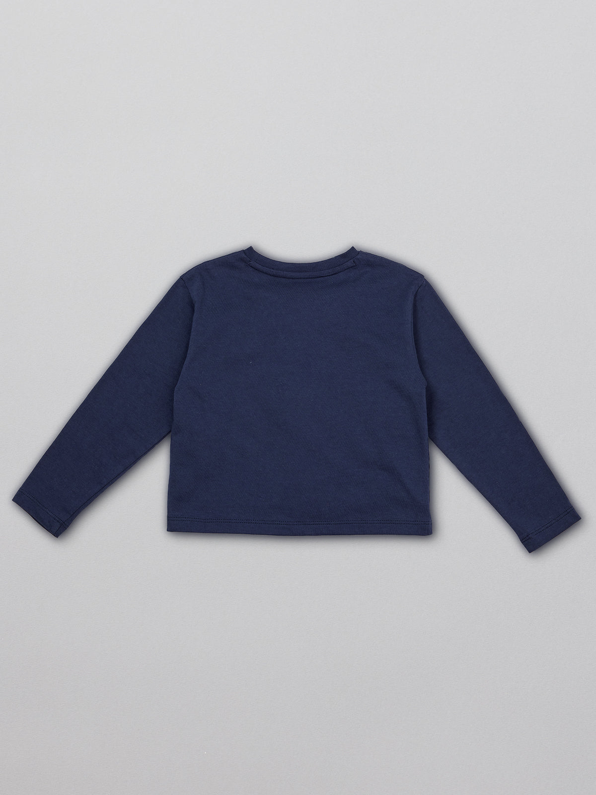 A sustainable kids long sleeved t-shirt in navy blue with a dinosaur print, pictured from the back. 