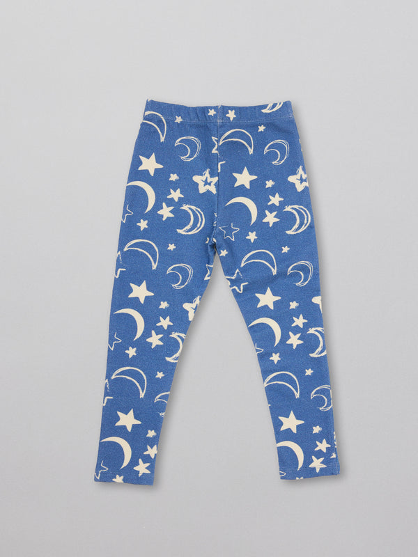 A pair of sustainable kids pyjama bottoms in blue with a white moon and star print.