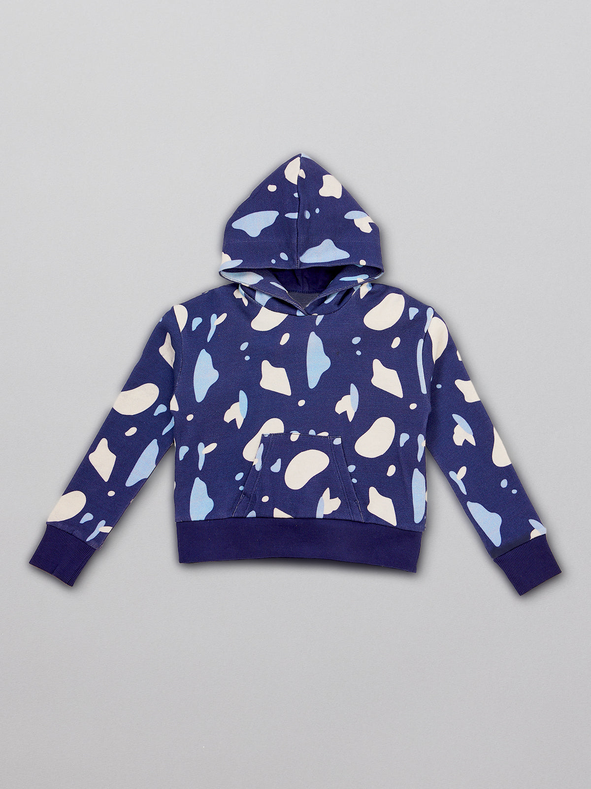Sustainable kids hoodie in navy with a blue and white terrazzo print, pictured from the front.