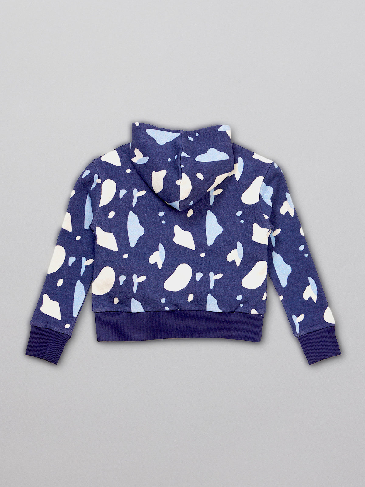Sustainable kids hoodie in navy with a blue and white terrazzo print, pictured from the back.