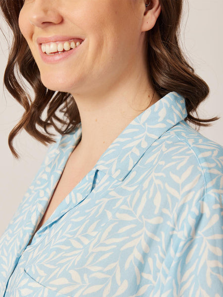 A close up of a model wearing the sustainable Sian PJ set from This is Unfolded, focusing on the collar and print. 